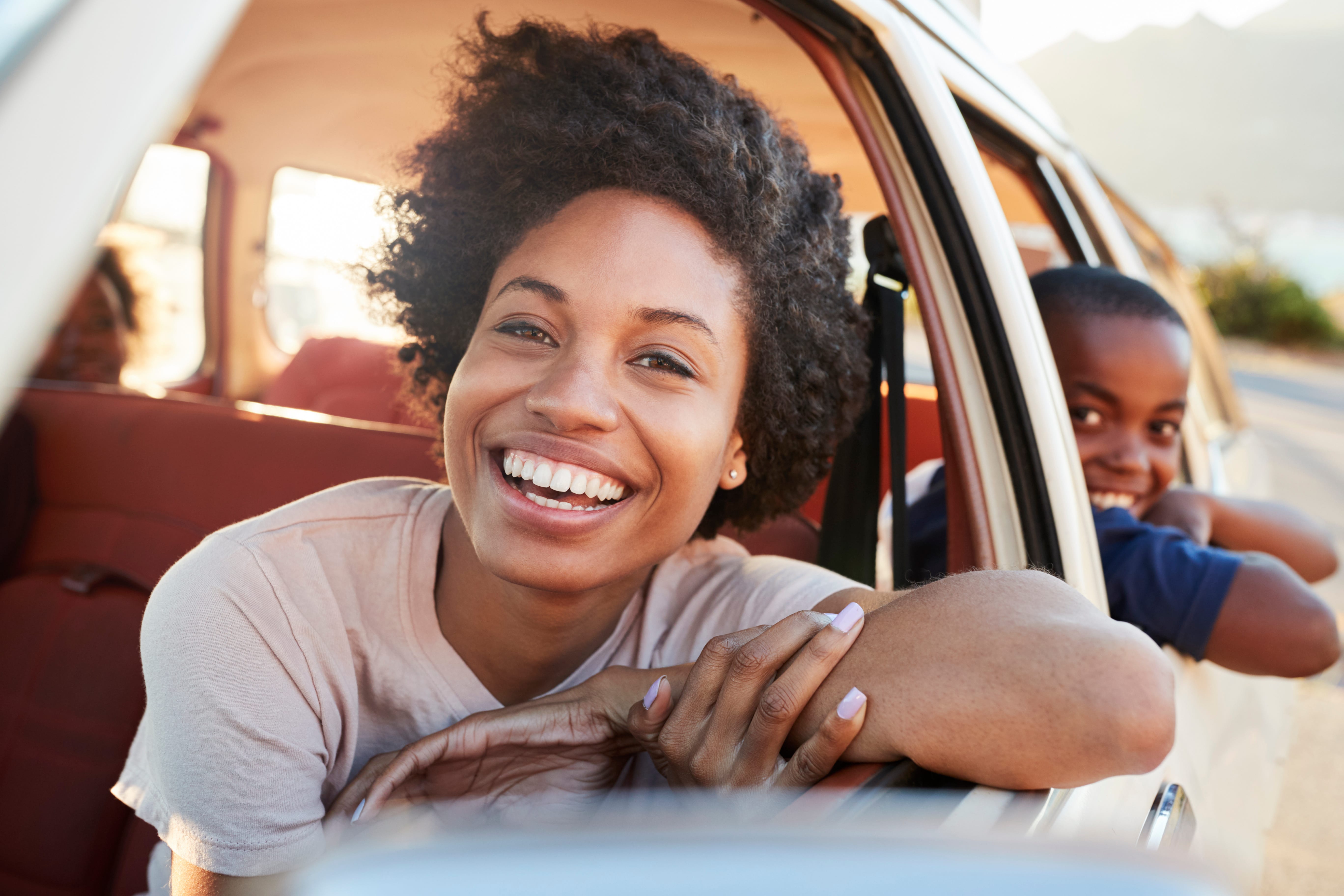 woman driving car auto loans in michigan